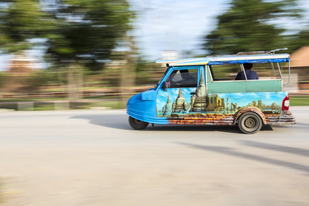 Tuk-Tuk in motion blur at Ayutthaya,Thailand three wheels taxi