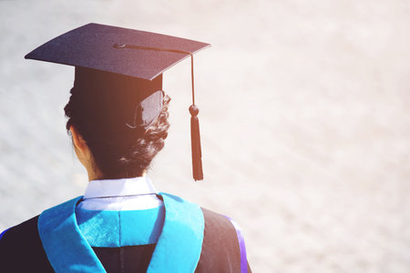 backside female graduation hats during commencement success graduates of the university, Concept education congratulation. Graduation Ceremony ,Congratulated the graduates in University.の写真素材