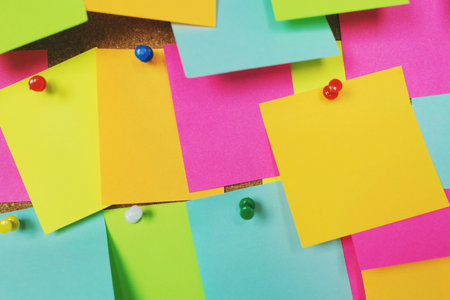 collection of colorful variety notes. paper note reminder sticky notes pin on cork bulletin board. empty space for text.の写真素材