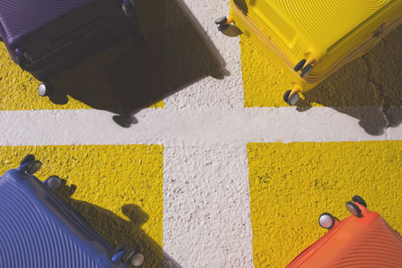 baggage luggage suitcase colorful placed on floor street the square schedule color yellow. travel holiday summer concept and idea creative. Leave copy space empty to write a message.の写真素材
