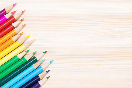 Close up of color pencils pile pencil tipped nibs put lined on the desk wooden. idea education back to school concept. Leave copy space empty for text.の写真素材
