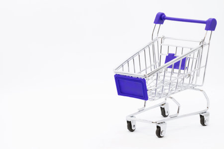Empty grocery hand cart Shopping cart color red, Mini Supermarket Car Isolated On White Backgroundの写真素材
