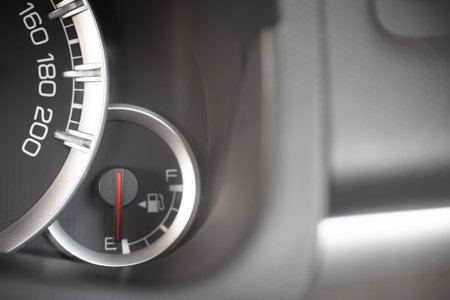 close up image of a car's fuel gauge meter. fuel level gauges on a car's dashboard and Car need...