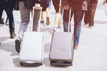 Business man with suitcase on street road traveler with luggage walking hustle Heading go to the airport. baggage travel. soft focus.の写真素材