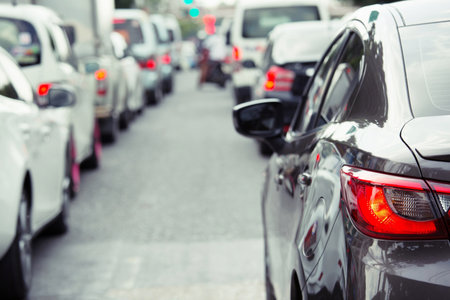 traffic jam in a city street road row of car on express way in rush hour. Traffic lights. parking car.の写真素材