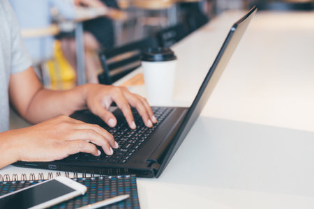 people man connect online business using computer laptop. or sitting work at on the desk.の写真素材