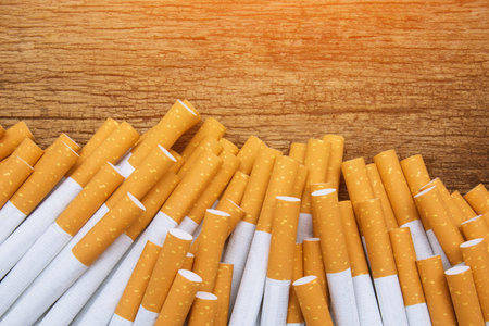 A top view image of several commercially made cigarettes. pile cigarette on wooden. or Non smoking campaign conceptの写真素材