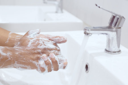Hygiene. Cleaning Hands. Washing hands with soap under the faucet with water Pay dirt.の写真素材