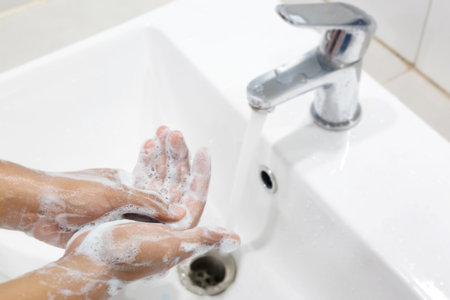 Hygiene. Cleaning Hands. Washing hands with soap under the faucet with water Pay dirt.の写真素材