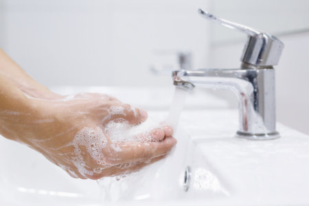 Hygiene. Cleaning Hands. Washing hands with soap under the faucet with water Pay dirt.の写真素材