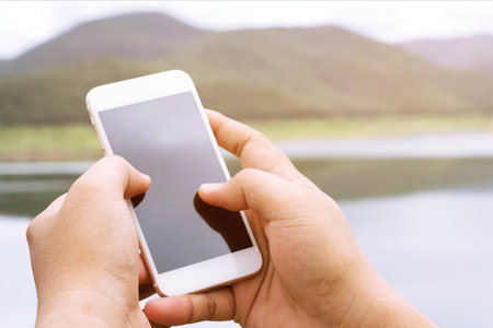 Lifestyle on a relaxing day close up hand woman using cell phones to communicate in the online...