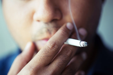 man smoking a cigarette. Cigarette smoke spread.の写真素材