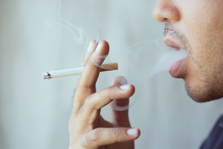 man smoking a cigarette. Cigarette smoke spread.の写真素材
