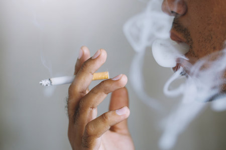 man smoking a cigarette. Cigarette smoke spread.の写真素材