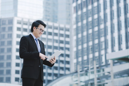 close up of Young Man using tablet. or Business man Contact Customerの写真素材