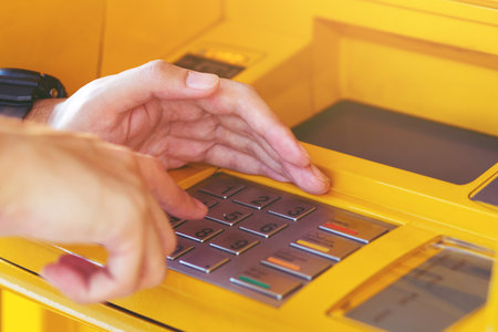 Press the money the password. ATM machine Put your hands off protect Secret code password withdraw.の写真素材