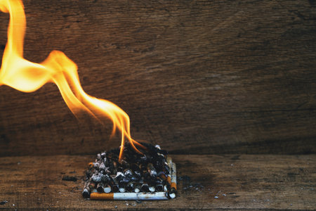 burning cigarette In the wood floor. Campaign no smoking concept.の写真素材