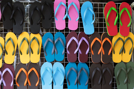 Summer holiday concept. Pair of sandals on the beach. casual shoes Colorful variety.の素材 [FY310112980916]