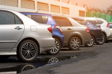 Cars parked in the parking lot.Open space area Outdoors.の写真素材