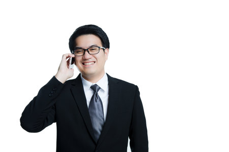 Handsome Business man in an using telephoneの写真素材