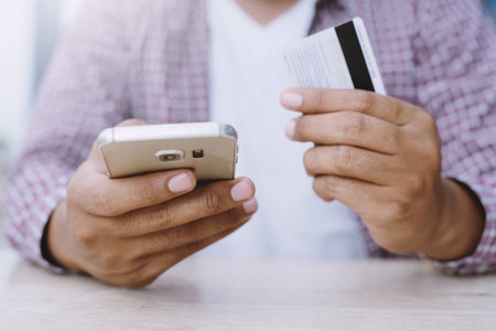 Hands holding credit card and using laptop. Online shopping purchase Sell or Payment.