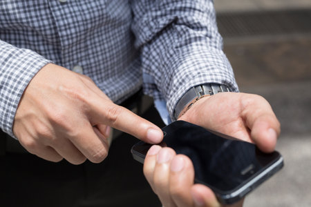 close up of Young Man using telephone. or Business man Contact Customer.の写真素材
