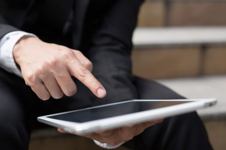 Young businessman using tablet adult working on a digital.の写真素材