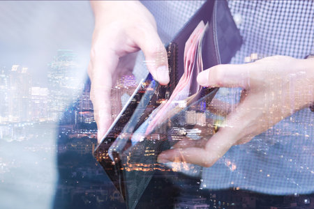 close up young man Person holding a wallet in the hands of an man take money out of pocket. finance conceptの写真素材