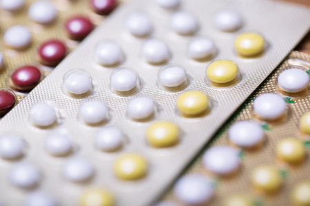 Close up Oral contraceptive pill on pharmacy counter with colorful pills strips. Contraception reduces childbirth concept.の写真素材