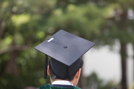 graduation,Student hold hats in hand during commencement success graduates of the university
