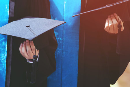 graduation,Student hold hats in hand during commencement success graduates of the university,Concept...