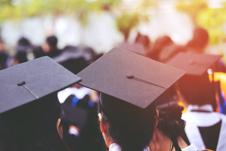 shot back side young female of graduation hats during commencement success graduates of the university, Concept education congratulation. Graduation Ceremony ,Congratulated the graduates in Universityの写真素材