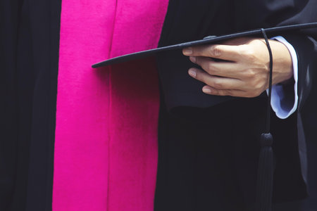 Group of Graduates during commencement. Concept education congratulation in University. Graduation Ceremony in University during commencement. close up hat.の写真素材