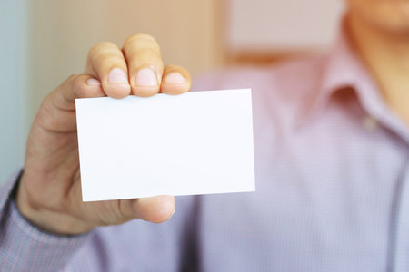 People man hand hold business cards show blank white card mock up. or pasteboard credit name card...