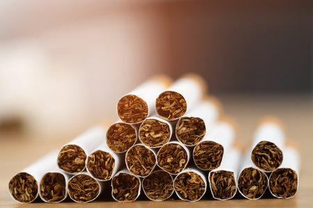 image of several commercially made cigarettes. pile stack cigarette on wooden. or Non smoking campaign concept, tobaccoの写真素材