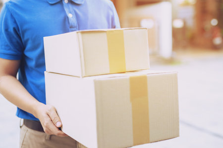 parcel delivery man of a package through a service send to home. consign hand Submission customer...