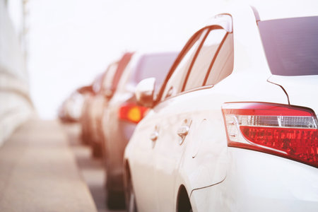Full parking. Aerial car parking lot outdoors, back cars in row Parking on the side of along the road beside the road. transport conceptの写真素材