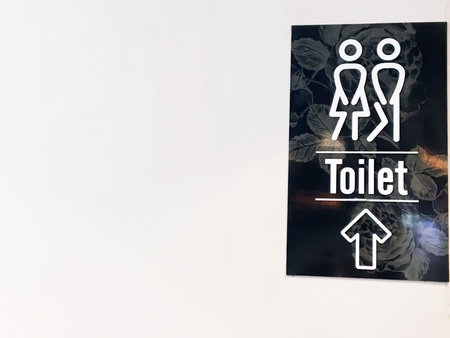 Toilet sign icons set. Man and woman WC signs for restroom on white wall background. Leave space to write a message. Restroom Conceptの写真素材