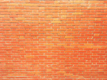 empty brick wall texture painted orange pastel background vintage interior design.の写真素材
