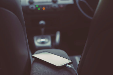 charge the battery phone in car. Place the mobile smart phone in the car.の写真素材