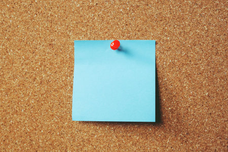 collection of colorful variety. paper note pad reminder sticky notes pin paper yellow on cork bulletin board. empty space for text.の写真素材