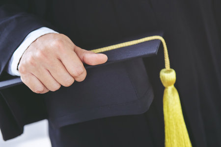 backside graduation hats during commencement success graduates of the university, Concept education congratulation. Graduation Ceremony, Congratulated the graduates in University during commencement.の写真素材
