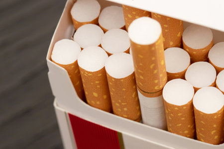 peel it off Cigarette pack prepare smoking a cigarette on the wooden. Packing line up. photo filters Natural light. soft focus. Leave space to write a description of the message.の写真素材