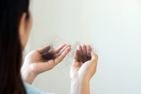 Woman have hair loss due to allergic to shampooの写真素材