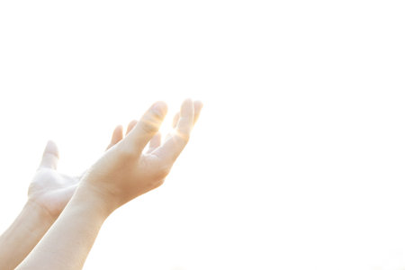 Human hands open palm up worship Praying hands with faith and belief in God of an appeal to the sky.の写真素材