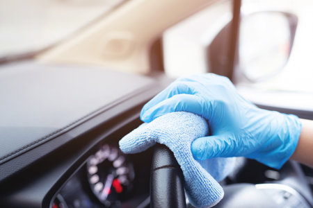 Staff is cleaning the inside of the car for prevent the virus.