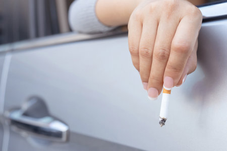 Women smoke in the carの写真素材