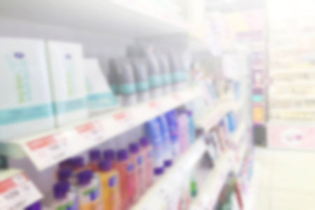 Supermarket aisle with empty red shoppingの写真素材