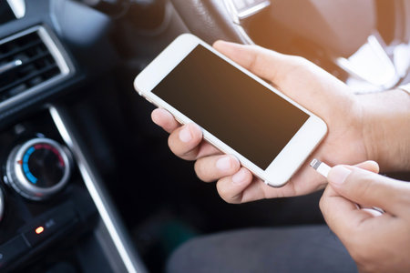 People are charging batteries. Phone in the car.の写真素材