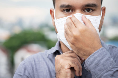 Men wearing masks to protect the corona virusの写真素材